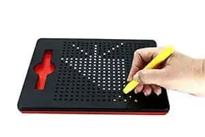 Child using a magnetic drawing board for kids with a yellow stylus to create patterns.